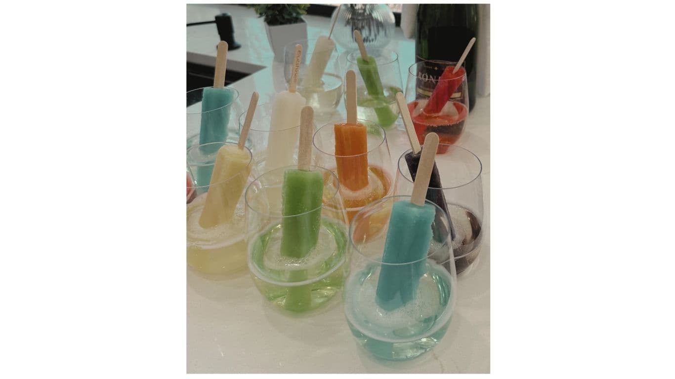 Colorful popsicle display in wine glasses — styled detail by EC Collective