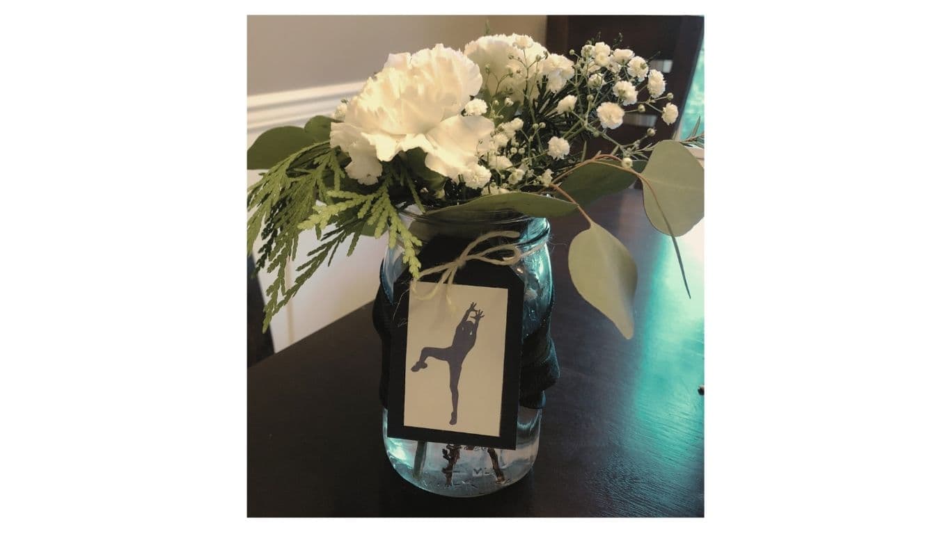 Mason jar floral centerpiece with greenery — a signature EC Collective detail