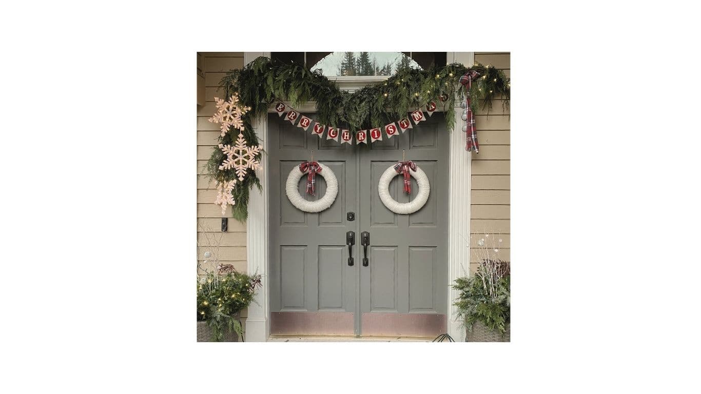 Christmas double-door porch styling with wreaths and Merry Christmas banner by EC Collective
