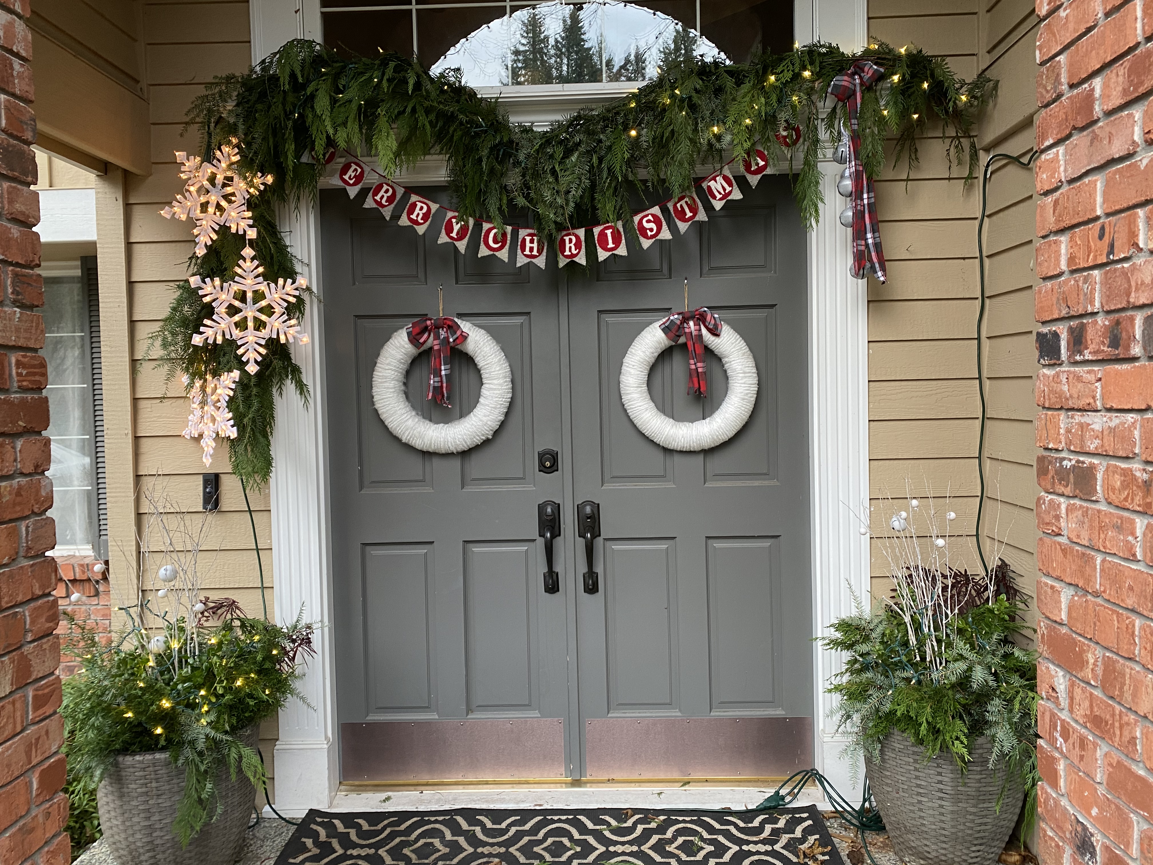 Holiday porch decor by Elevated Creations